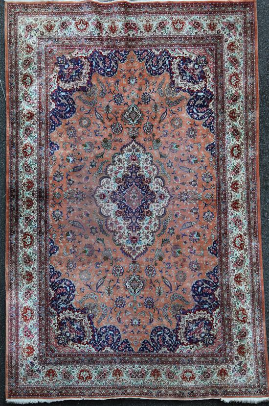 A Persian silk rug, 9ft 8in by 6ft 5in.
